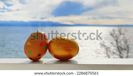 Painted DIY handmade unique easter eggs with modern colour patterns and in gold color