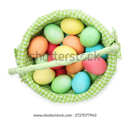 Painted Easter eggs in basket isolated on white, top view