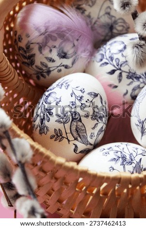 Painted Easter eggs and pussy willow branches. Traditional painted Easter eggs in a basket. Easter card. Happy Easter. Holiday. Traditions. Lifestyle.