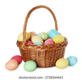 Painted Easter eggs in wicker basket isolated on white