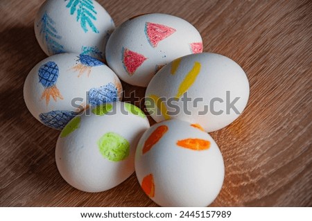Painted eggs. Easter eggs on wooden table. Happy Easter holiday celebration. Easter bunny hunt. Spring holiday at Sunday. Eastertide and Eastertime. Good Friday. Hunting eggs. Egg hunt tradition.