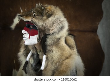 Painted Face, Native American Woman With War Mask And Wolf Skin. Cracked Paint. Young Shaman Girl With Deer Skull Staff Part Of Large Series Of Painted Tribal Portraits