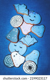 Painted Gingerbread Halloween Cookies On A Blue Background. View From Above.