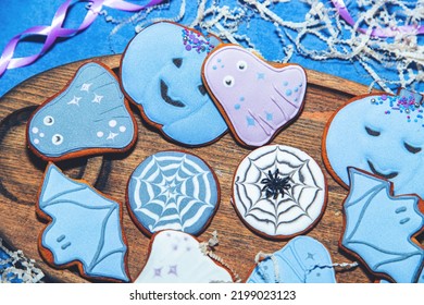 Painted Gingerbread Halloween Cookies On A Blue Background. View From Above.