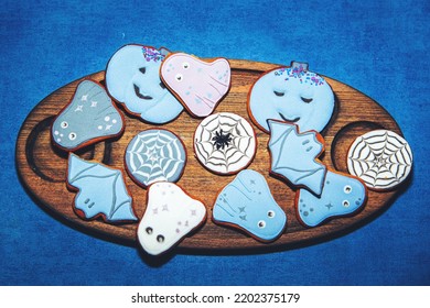 Painted Gingerbread Halloween Cookies On A Blue Background. View From Above.