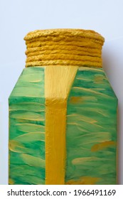 Painted with gold and red paint glass jar of coffee. It turned out to be a colored vase.