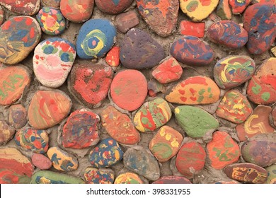 Painted gravels on a wall - Shutterstock ID 398331955
