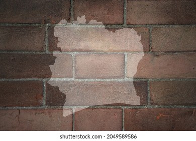 painted map of cote divoire on a old brick wall
