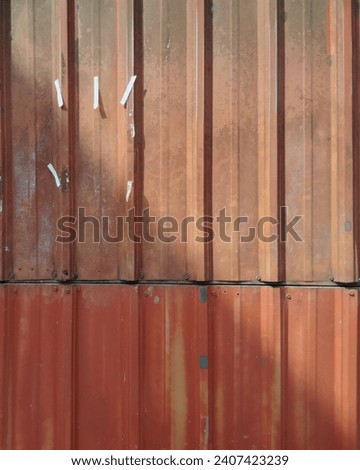 painted metal fence. Rusty and corroted