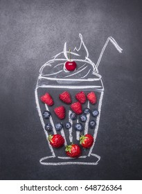 Painted On A Chalkboard, Milkshake, With Strawberries, Raspberries And Blueberries, Top View