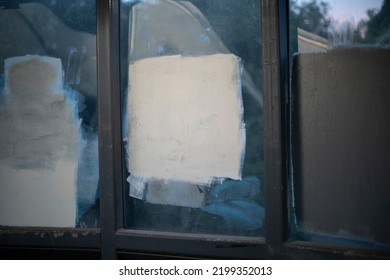 Painted Over Graffiti. Fight Against Vandalism. White Square On Glass. Painting Over Labels.