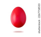 Painted in red natural easter chicken egg flying isolated on white background. One red festive egg closeup. Happy Easter spring decoration.