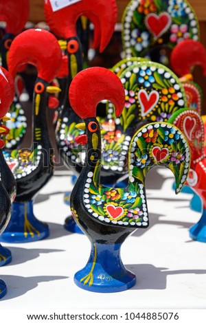Painted rooster ornaments which are the unofficial symbol of Portugal, Algarve, Portugal, Europe.