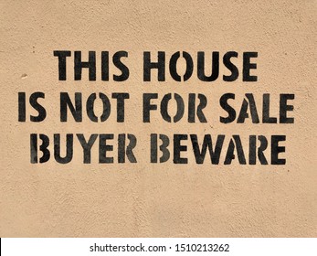 Painted Sign On House. Not For Sale Buyer Beware.