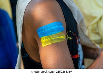 Painted Ukrainian Flag On Woman Hand During A Demonstration Against Russian Interference In Ukraine In Bangkok, Thailand, Close Up