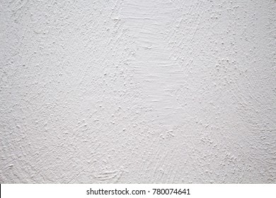 Painted Wall With Rough Texture Closeup Photo. White Plaster With Brushed Texture. White House Wall. Greek Architecture Background. Pottery House Wall. White Painted Surface. Vintage Or Shabby Chic