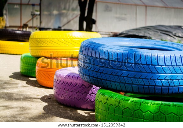 painted waste tyres at\
garden.