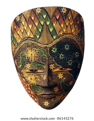 Painted wooden indonesian mask, isolated on a white background, by clipping path. Patterns of green, orange and yellows flowers.