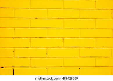 painted yellow brick wall as a background