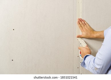 Painter Glue The Joints Between The Drywall, Plasterboard Sheets.