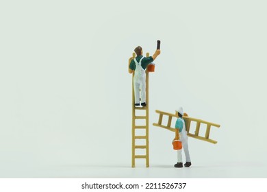 Painter with ladder at work isolated on white background - Shutterstock ID 2211526737