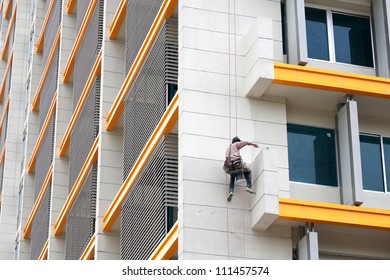 Painter paint the facade of building