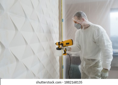 The Painter Is Painting A 3d Wall With A Spray Gun.