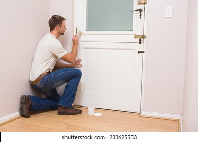 Painter Painting The Door White In A New House