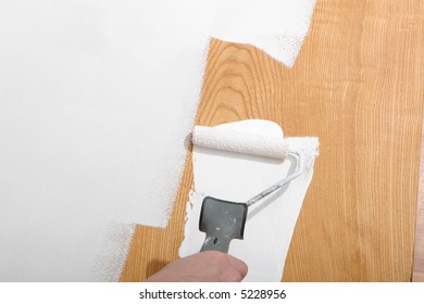 painter painting woodpanel white