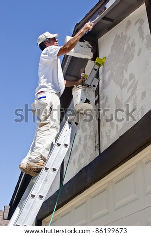 Similar – Image, Stock Photo Worker on ladder uses hand drill, ACU power tool and twists screws on rock wool isolated gypsum dry wall