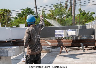 The Painter Is Working To Fireproof Paint On Steel Structure With Spray Gun, At Industrial Factory.