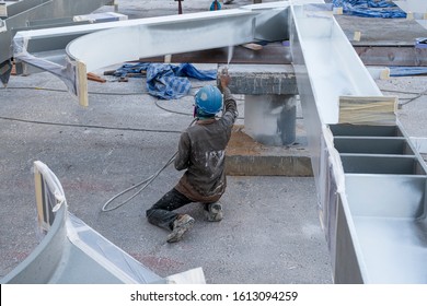 The Painter Is Working To Fireproof Paint On Steel Structure With Spray Gun, At Industrial Factory.