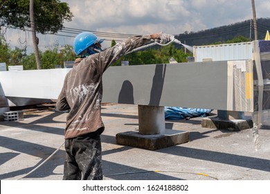 The Painter Is Working To Fireproof Paint On Steel Structure With Spray Gun, At Industrial Factory.