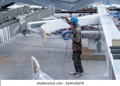 The Painter Is Working To Fireproof Paint On Steel Structure With Spray Gun, At Industrial Factory.