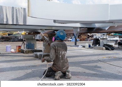 The Painter Is Working To Fireproof Paint On Steel Structure With Spray Gun, At Industrial Factory.