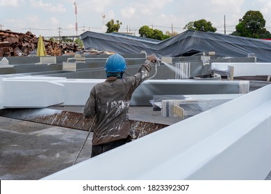 The Painter Is Working To Fireproof Paint On Steel Structure With Spray Gun, At Industrial Factory.