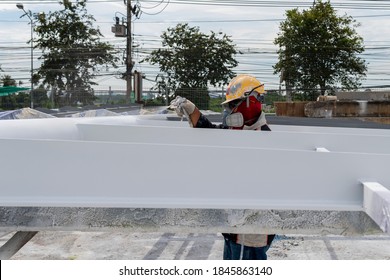 The Painter Is Working To Fireproof Paint On Steel Structure With Spray Gun, At Industrial Factory.