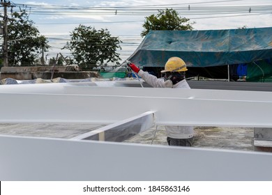 The Painter Is Working To Fireproof Paint On Steel Structure With Spray Gun, At Industrial Factory.