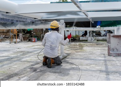 The Painter Is Working To Fireproof Paint On Steel Structure With Spray Gun, At Industrial Factory.