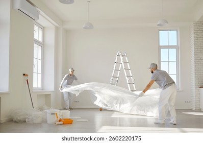 Painters team or construction workers planning repair, floor covering to protect during color renovation after moving into new apartment, interior design home plan, new house remodeling ideas