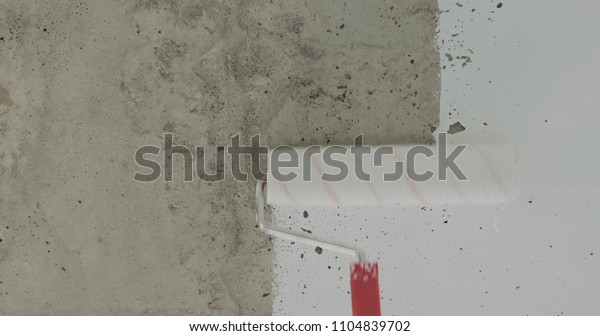 Painting Concrete Ceiling Into White Roller Stock Photo