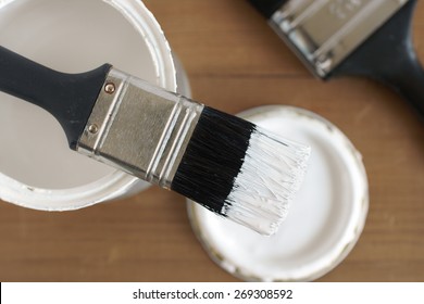 Painting And Decorating Shallow Focus Top Down View Of A Pot Of White Paint And Brush