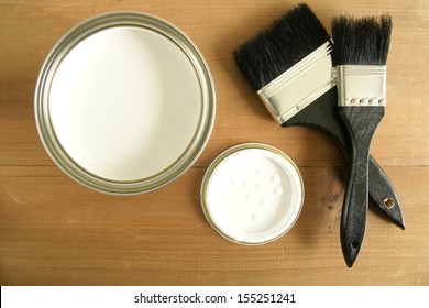 Painting And Decorating  Top Down View Of A Pot Of White Paint And Brushes