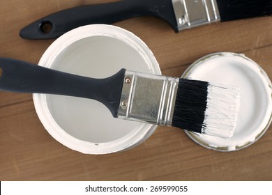 Painting And Decorating Top Down View Of A Pot Of White Paint And Brush