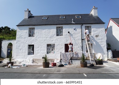 Painting exterior of house
