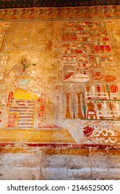 Painting image on the wall of God Anubis Shrine in Mortuary Temple of Hatshepsut at Valley of The Kings, Luxor, Upper Egypt. Anubis presented with bounteous offerings. - Shutterstock ID 2146525005