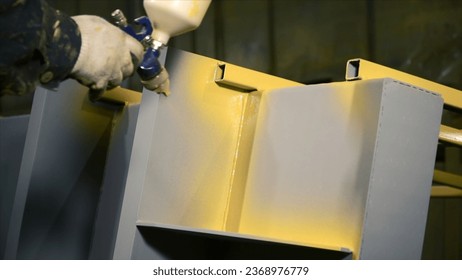 Painting of industrial part. Clip. Spray painting of large iron part at industrial plant. Coating part with paint against corrosion at factory - Powered by Shutterstock