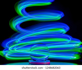 Painting with light method using long exposure shutter speed creating abstract patterns with objects
