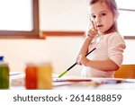 Painting, mess and art with portrait of girl in house for child development, drawing talent and education. Creative, kindergarten and sketch with kid in family home for future, youth and color