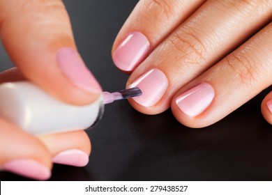 Painting Nails. Black Background.